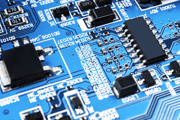 Macro shot of a Circuitboard with resistors microchips and electronic components. Computer hardware technology. Integrated communication processor. Information engineering. Semiconductor. PCB. Closeup - Foto, afbeelding