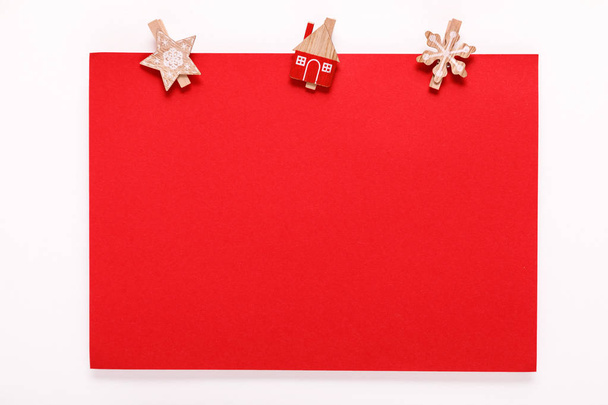 red paper card on a christmas clothes peg - Foto, Imagem