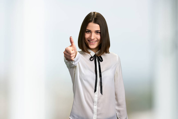 Excited business woman showing thumb up. - Photo, Image