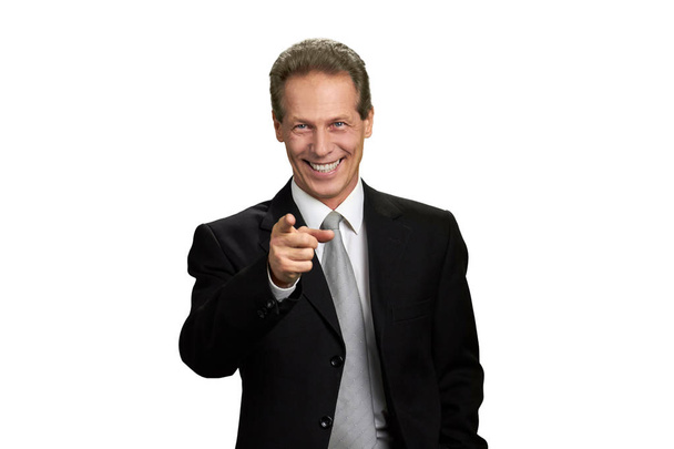 Happy businessman indicating with finger to camera. - 写真・画像