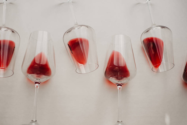 Glasses of red  wine  on white background, flat lay, copy space.  Wine degustation concept - Zdjęcie, obraz