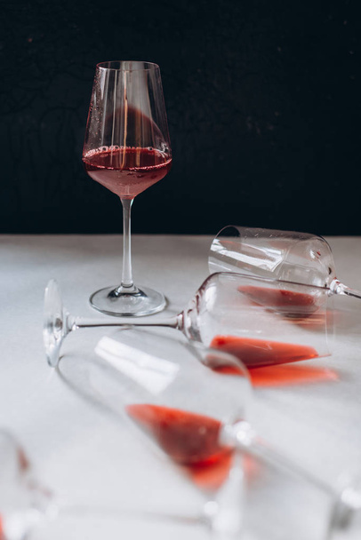 Glasses of red  wine  on white and dark background,  copy space.  Wine degustation concept - 写真・画像