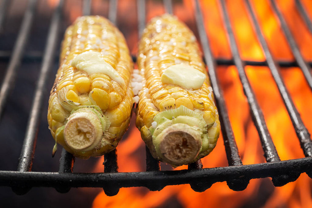 Tasty and homemade corncob on grill with butter and salt - Zdjęcie, obraz
