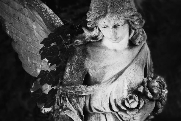 Angel in the sunlight.  Fragment of ancient statue. Retro styled. - Photo, Image