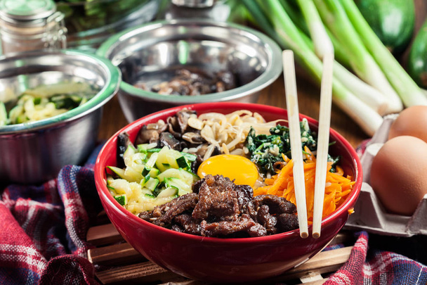 Bibimbap - rice with beef and vegetables. Traditional Korean dish. - Fotoğraf, Görsel