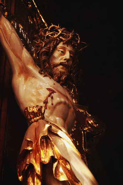 Jesus Christ crucified (an wooden sculpture) (fragment) - Photo, Image