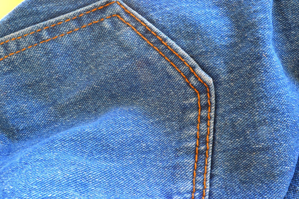 Detalhe de um par de calças de ganga
 - Foto, Imagem