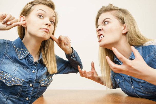 Two women having argue mocking up being mad at each other. Female telling off, ignorance concept. - Foto, imagen