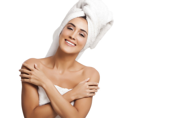 Pretty woman with a towel around her head - Photo, image