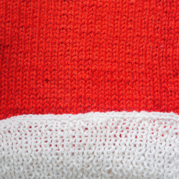 Red and white knitted woolen background with copy space for text Christmas concept - Foto, Bild