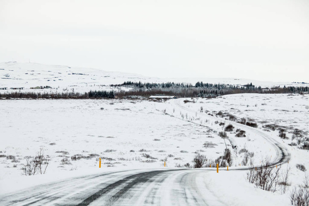 Beautiful and dangerous driving road in winter snow Iceland - 写真・画像