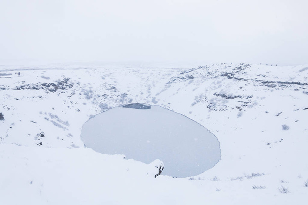 Kerid volcano crater during winter snow in Iceland - Fotó, kép