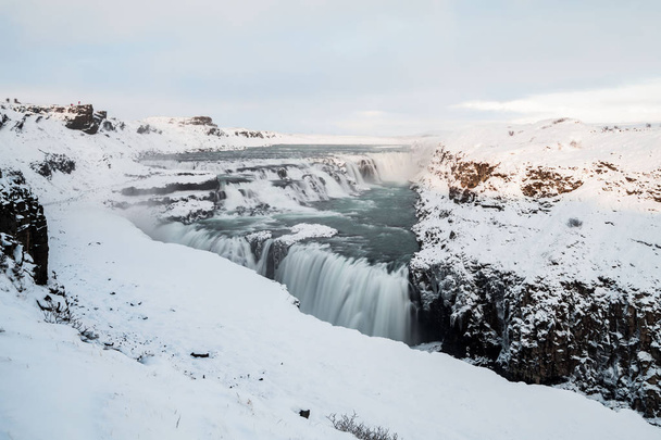 Gullfoss waterfall view in the canyon of the Hvita river during winter snow Iceland - Photo, image