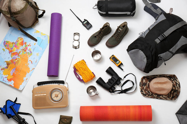 Flat lay composition with camping equipment on white background - Photo, Image