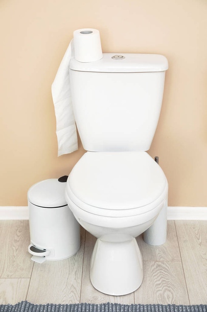 Paper roll on toilet tank in bathroom - Foto, imagen