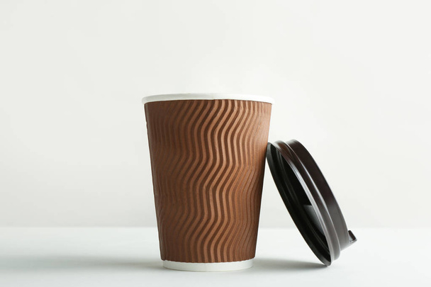 Takeaway paper coffee cup and lid on white background - Photo, image