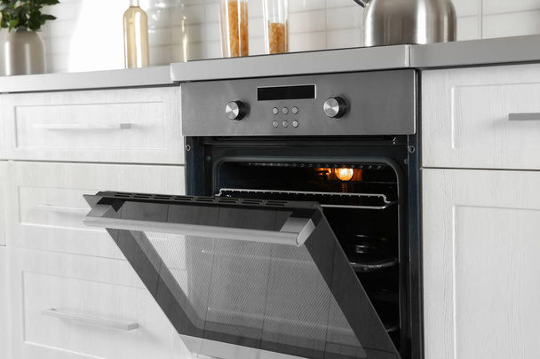 Open modern oven built in kitchen furniture - Fotó, kép