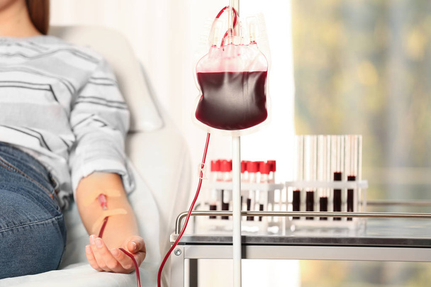 Woman making blood donation at hospital, closeup - Foto, Bild