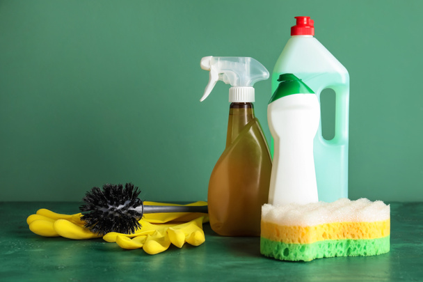 Set of cleaning supplies on color table - Photo, Image