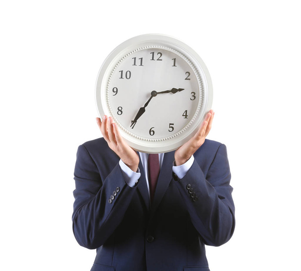 Businessman with clock on white background - Фото, зображення