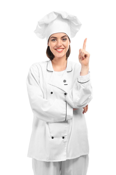Jonge vrouwelijke chef-kok op witte achtergrond - Foto, afbeelding