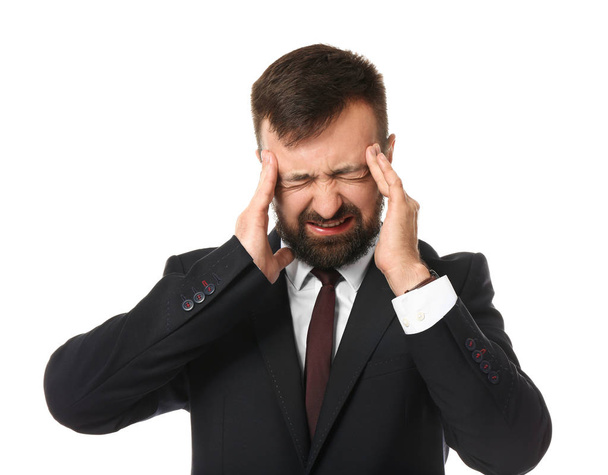 Businessman suffering from headache on white background - Фото, зображення