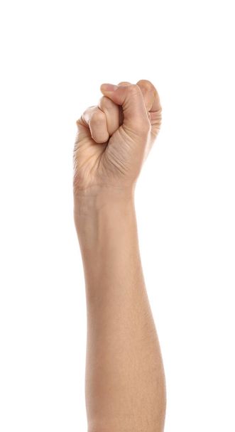 Mão feminina com punho apertado no fundo branco
 - Foto, Imagem