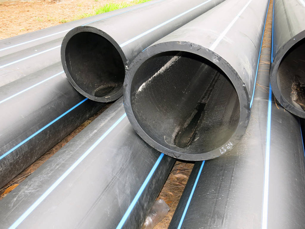 industrial pipes, plastic pvc pipes. construction site. - Foto, afbeelding