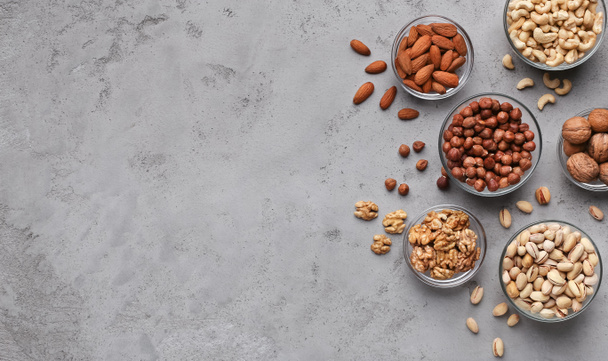 Variety of nuts on grey stone background - Photo, Image