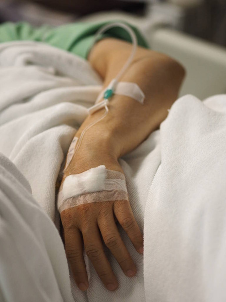 Closeup hand Patients sleep to saline at the hospital ward  - Φωτογραφία, εικόνα