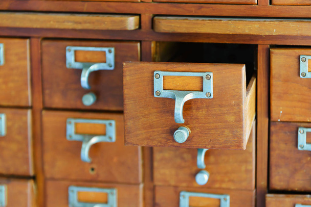 Old wooden vintage Medicine drawer cabinet. Catalog file cabinet. Data storage - Photo, Image