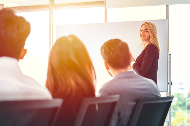 Business smart woman presentation in office meeting with white board. - Фото, зображення