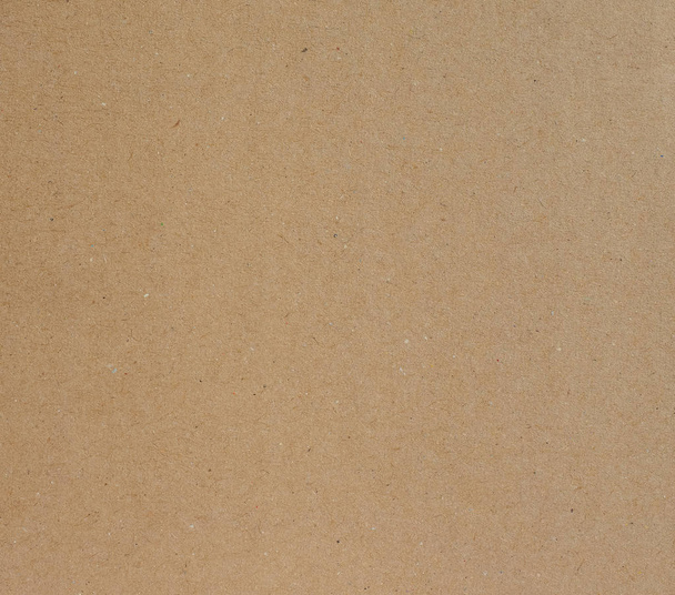 Brown corrugated cardboard useful as a background, soft pastel colour - Photo, Image