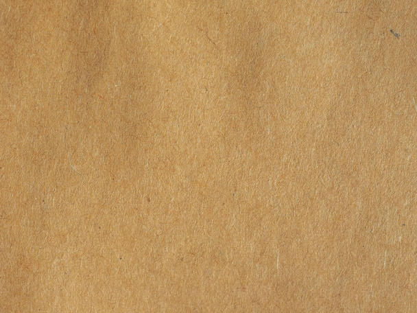 brown paper texture useful as a background, soft pastel colour - Photo, Image