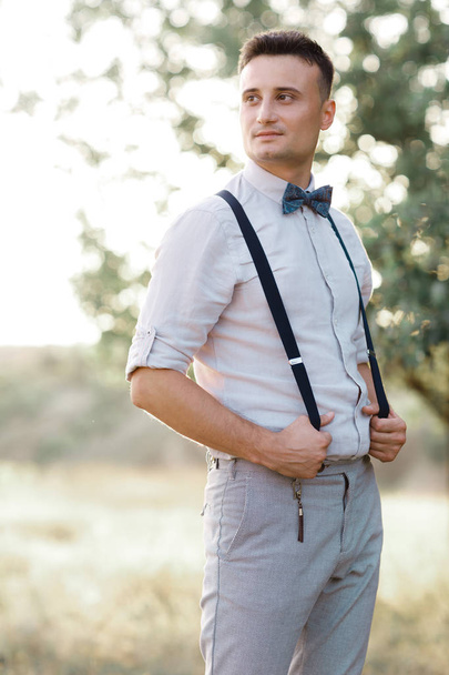 Portrait of a young handsome groom outdoors. - Foto, Imagem