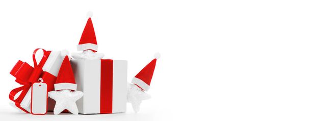 Christmas present with santa claus hat isolated on white background - 写真・画像