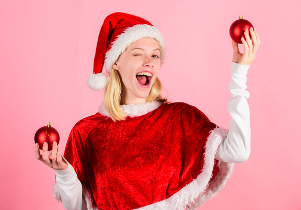 Favorite time year christmas. Girl happy wear santa costume celebrate christmas hold ball decor pink background. Merry christmas and happy new year. Christmas preparation concept. Lets have fun - Foto, immagini