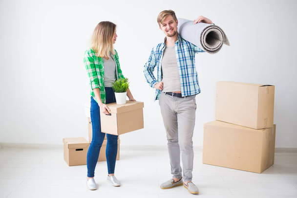 Family, new apartment and relocation concept - Young couple moving in new house - Photo, Image