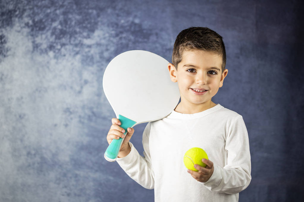 Little kid with a racket and a ball - Fotoğraf, Görsel