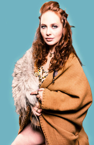 Beautiful woman in a viking costume - Fotoğraf, Görsel