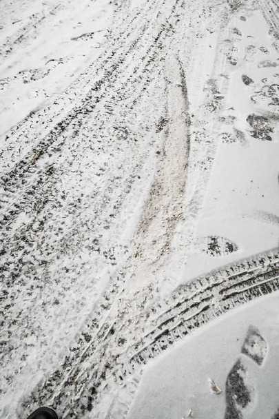 traces of cars in the snow icy road - Photo, Image