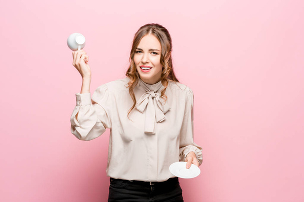 The serious frustrated young beautiful business woman on pink background - Photo, Image