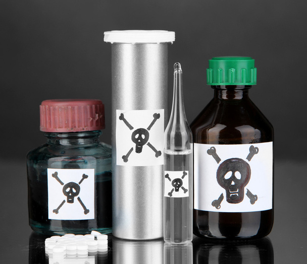 Deadly poison in bottles on black background - Foto, Bild