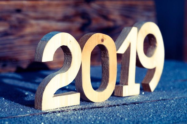 Wooden number 2019 on wooden background. Happy new Year 2019. - Fotoğraf, Görsel