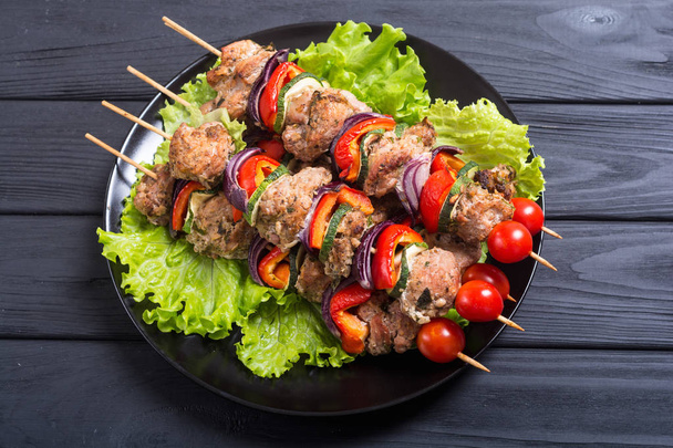 Grilled pork shish or kebab on skewers with vegetables . Food background shashlik - Φωτογραφία, εικόνα