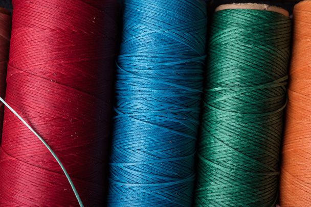 colorful bobbins with silk threads  - 写真・画像