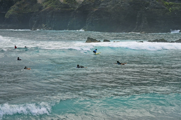 Tenerife, Canary Islands, Spain - April 01, 2018: Unidentified surfers in Atlantic ocean in Puerte de la Cruz - Foto, afbeelding