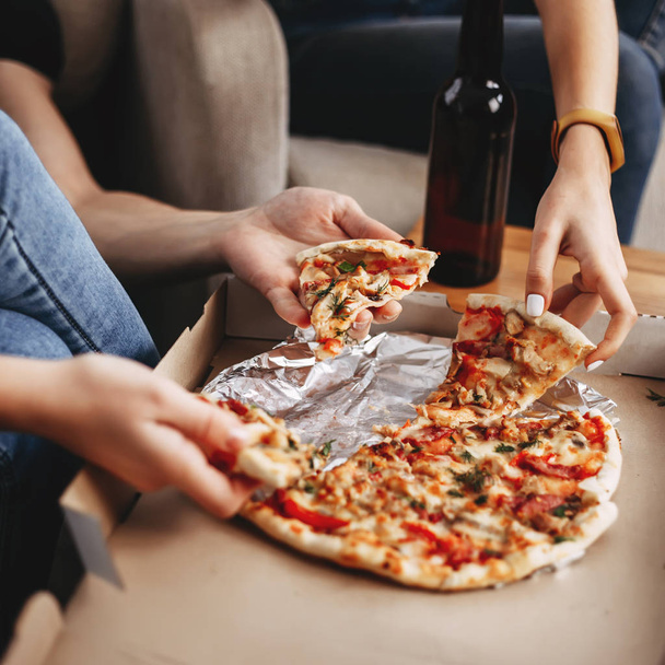 Hands of young people taking pizza slices - Photo, Image