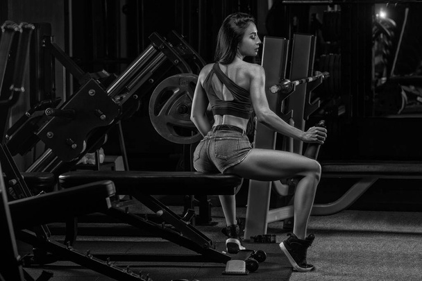 Fitness girl with shaker on a dark background - Fotografie, Obrázek