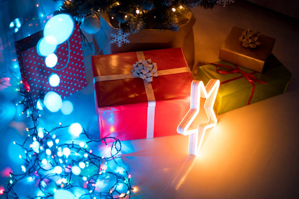Christmas LED lights decorations in dark living room at home - Foto, Imagem